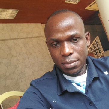 Kj, 40, Uganda